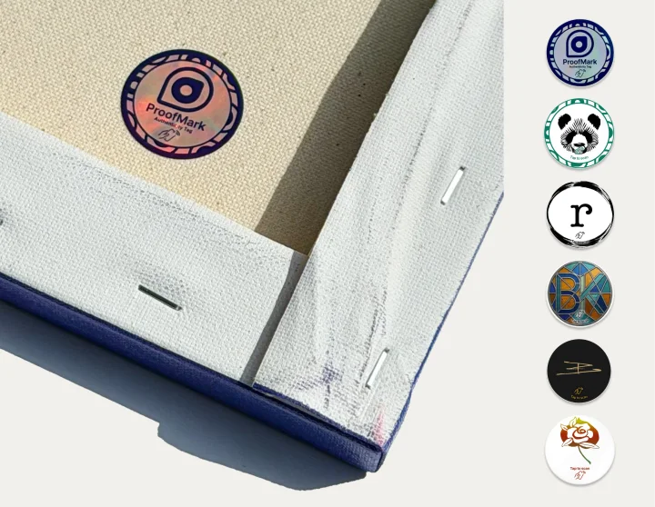 Proofmark holographic NFC tag attached to canvas with custom tag designs